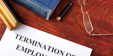 Is it possible to stay in the UAE after being terminated from a job?